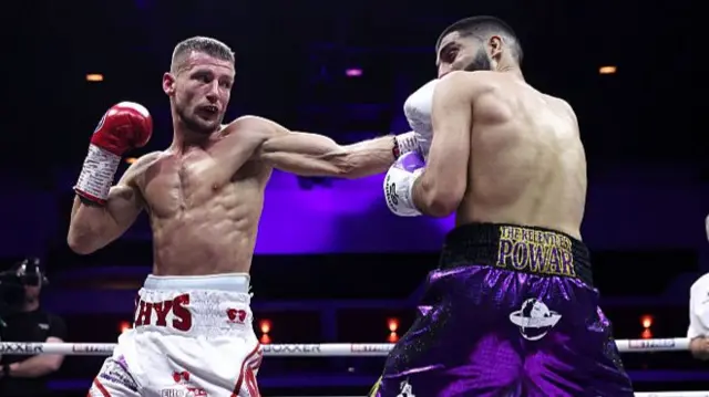 Rhys Edwards punches Gully Powar