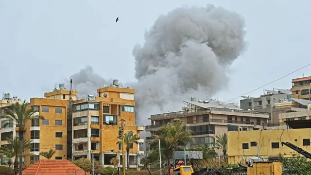 Smoke rises from the site of an Israeli airstrike that targeted a building in Beirut's southern suburbs