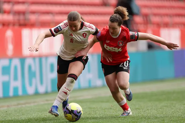 Players challenge for the ball