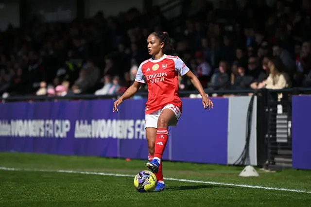 Taylor Hinds of Arsenal controls the ball