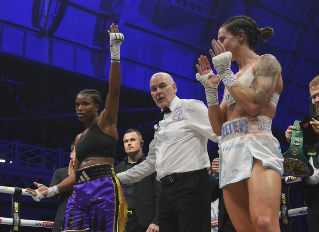 Caroline Dubois has her hand raised beside Terri Harper