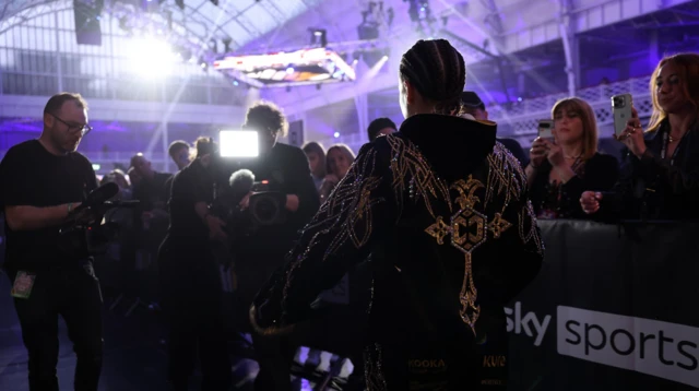 Chantelle Cameron makes her ringwalk with a camera filming her