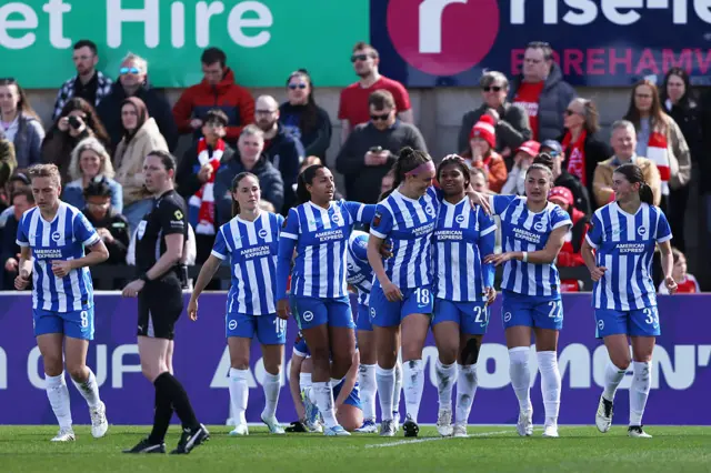 Madison Haley of Brighton & Hove Albion celebrates scoring against Arsenal