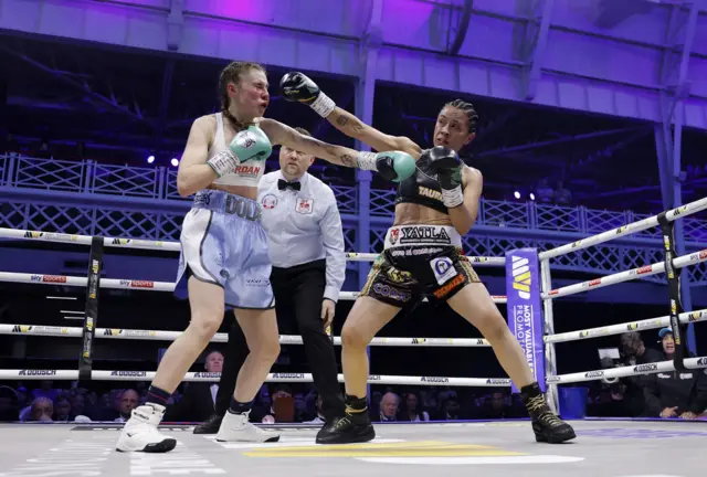 Emma Dolan is punched hard by Irma Garcia