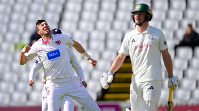 Craig Overton celebrates the wicket of Jack Haynes
