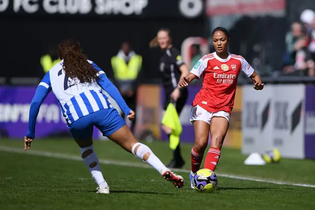 Taylor Hinds of Arsenal is challenged by Madison Haley of Brighton & Hove Albion