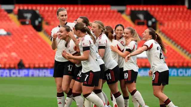 Zara Shaw celebrates with her team-mates