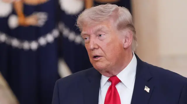 US President Donald Trump pauses after speaking about the Iran war from the Cross Hall of the White House in Washington DC.