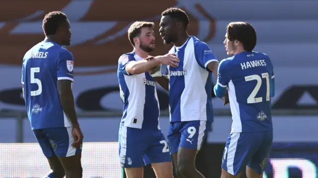 Mike Fondop of Oldham celebrates scoring their side's first goal