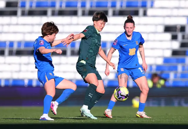 Fujino dribbles with the ball