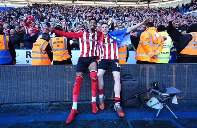 Lincoln City's Reeco Hackett-Fairchild and Dom Jefferies celebrate promotion