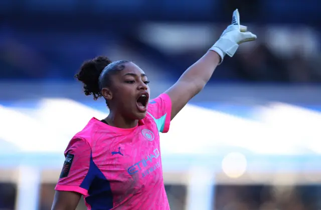 Keating shouts and points to her defence