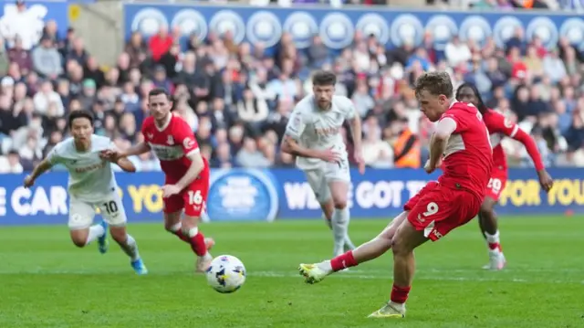 Tommy Conway scores from the penalty spot at Swansea