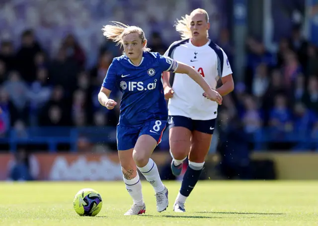 Erin Cuthbert runs with the ball
