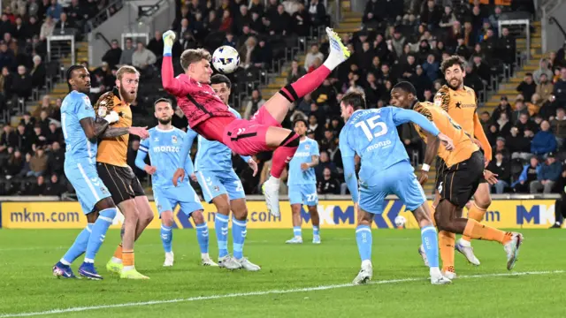 Coventry goalkeeper Carl Rushworth fails to collect a cross