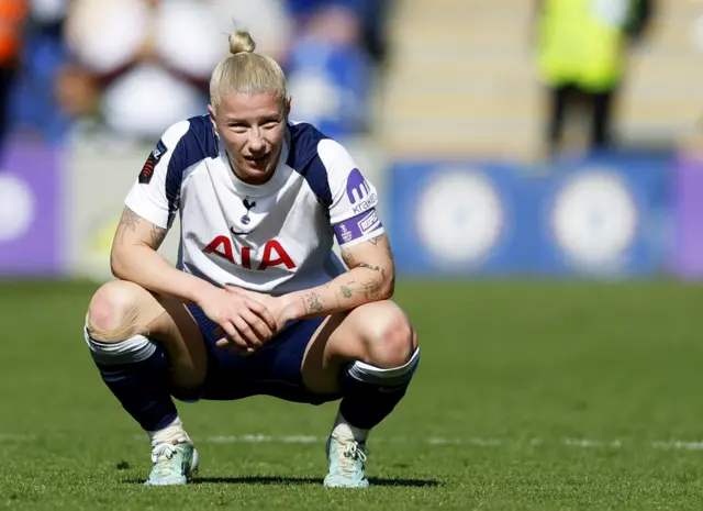 Beth England stands on her haunches
