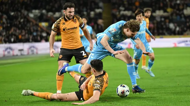 John Egan slides in to tackle Jack Rudoni