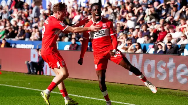 Alex Bangura celebrates