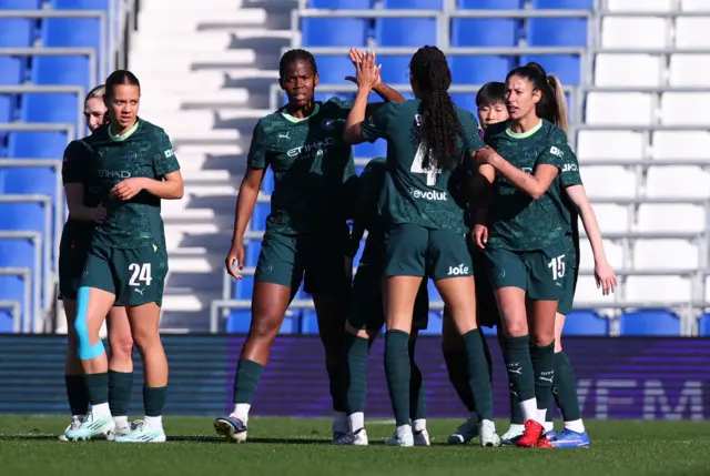 Shaw is congratulated by team-mates after scoring