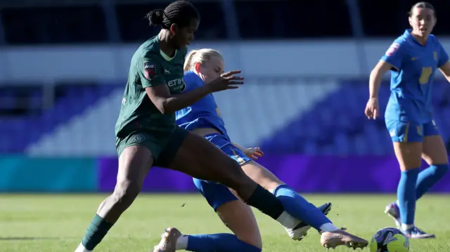 Shaw is tackled by Cooke