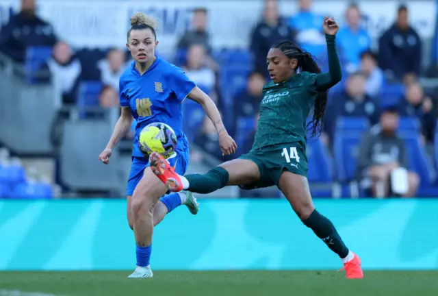 Kerolin dribbles the ball
