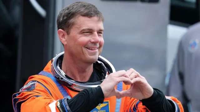 Commander Reid Wiseman of NASA speaks with family members during the walkout from the Neil A. Armstrong Operations and Checkout Building toward Launch Pad 39B as part of Artemis II's launch preparations in Titusville, Florida, USA, 01 April 2026.
