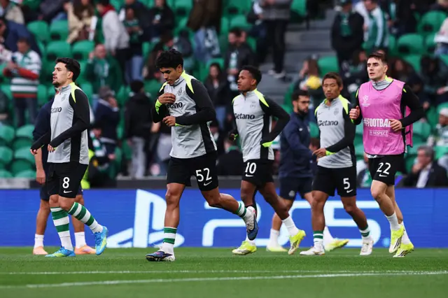 Joao Simoes of Sporting Clube de Portugal enters the pitch with teammates