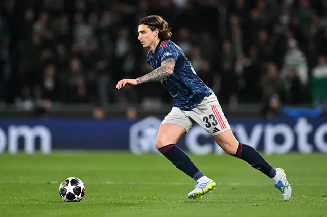 : Riccardo Calafiori of Arsenal runs with the ball
