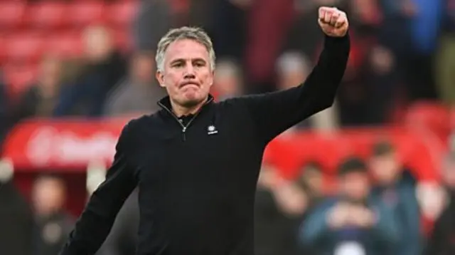 Phil Parkinson raises his fist in celebration