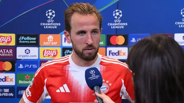 Harry Kane speaks to a TNT Sports reporter after the game