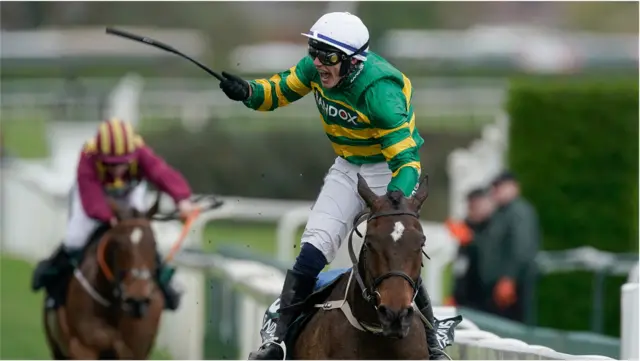 Paul Townend celebrates winning the 2024 Grand National with I Am Maximus