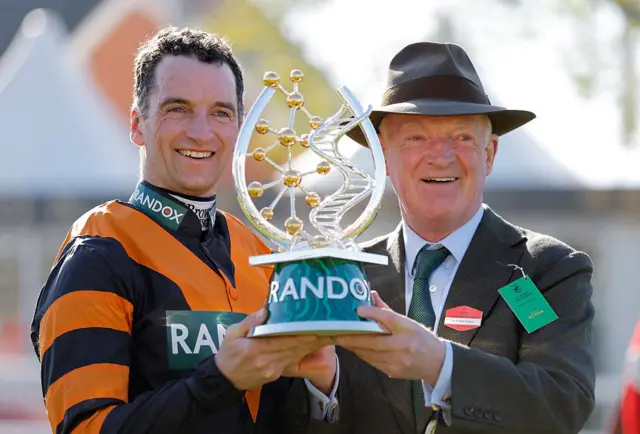 Patrick Mullins and Willie Mullins celebrate winning the 2025 Grand National