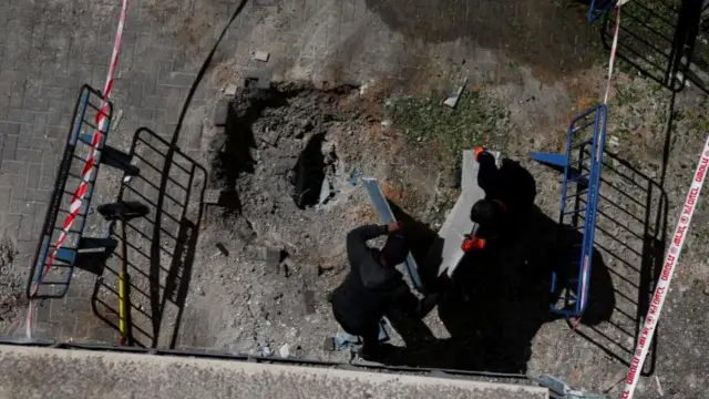 An impact site in central Israel, seen on Monday morning, after a barrage of Iranian missiles