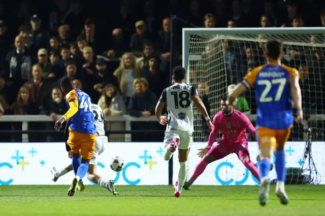 Bradley Ihionvien of Shrewsbury Town scoring a goal