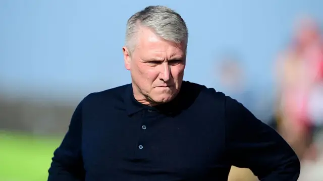 A grimacing Rotherham boss Lee Clark