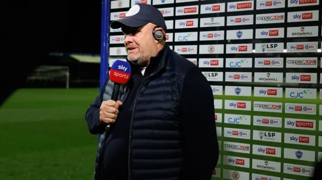 Bromley boss Andy Woodman being interviewed by Sky Sports