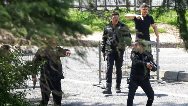 Police at the scene after gunfire was heard near the building housing the Israeli consulate in Istanbul.