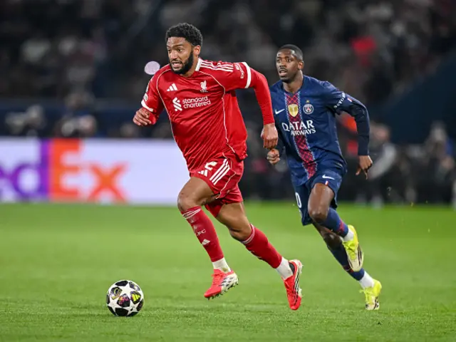 Joe Gomez of Liverpool FC and Ousmane Dembele of Paris Saint-Germain FC battle for the ball