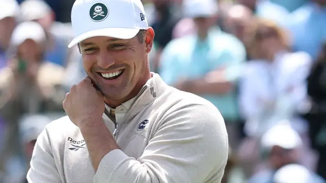 Bryson DeChambeau laughing while playing the par three contest at Augusta National