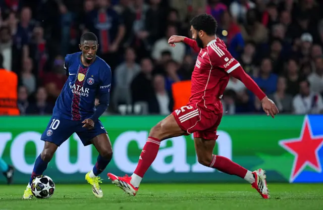 Ousmane Dembele of Paris Saint-Germain is challenged by Joe Gomez
