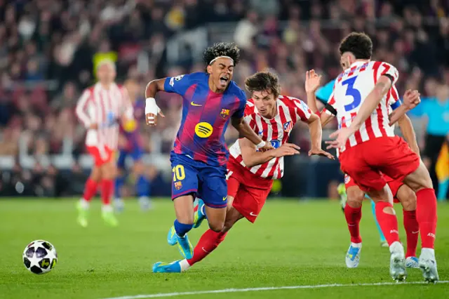 Lamine Yamal right winger of Barcelona and Spain and Robin Le Normand centre-back of Atletico de Madrid and Spain compete for the ball