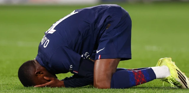 Paris St Germain's Ousmane Dembele reacts after missing a chance to score