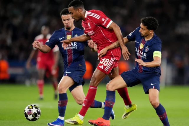 Liverpool's Ryan Gravenberch (centre) and Paris Saint-Germain's Aoas Correa Marquinhos
