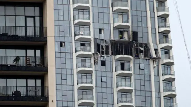 This picture from 12 March shows a damaged apartment block in Dubai after an Iranian attack
