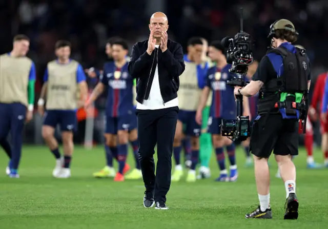 Arne Slot, Manager of Liverpool, applauds the fans