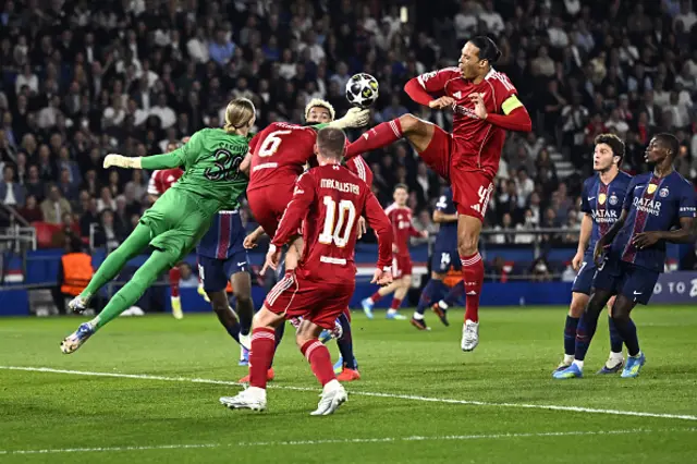 Matvey Safonov (L) makes a save in front of Liverpool's Dutch defender #04 Virgil van Dijk