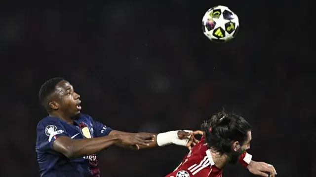 Willian Pacho (L) fights for the ball with Liverpool's Hungarian midfielder #08 Dominik Szoboszlai