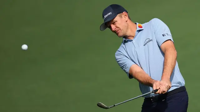 Justin Rose hits a chip during practice at the 2026 Masters