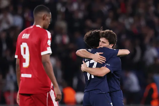 Paris Saint-Germain's Portuguese midfielder Joao Neves (R) celebrates with Paris Saint-Germain's Portuguese midfielder #17 Vitinha