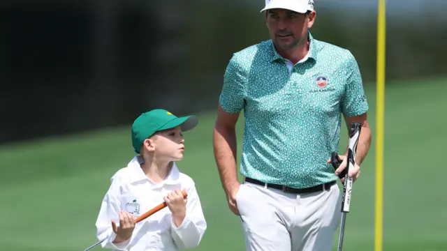 Keegan Bradley and his son during the par three contest at Augusta National